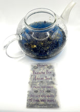 Load image into Gallery viewer, Tea packet by Lovewild Design with Butterfly Pea Flower Tea leaves. Teapot with blue liquid from tea leaves.
