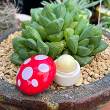 Load image into Gallery viewer, Lip balm shaped like a mushroom with a red lid with polka dots
